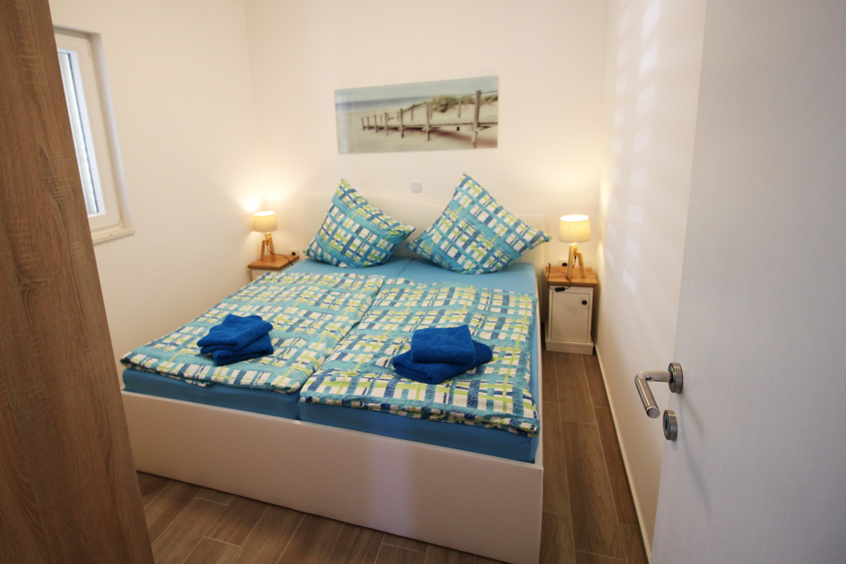 Ferienwohnung im Erdgeschoss - Schlafzimmer1 mit Doppelbett